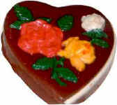 Large heart shaped box decoratedd with 3 roses - filled